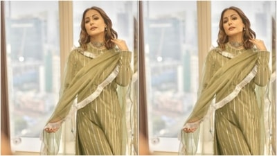 Hina decked up in a moss green long salwar featuring a closed neckline. The full-sleeved salwar also came with silver zari details at the neckline and throughout the salwar in stripes. (Instagram/@realhinakhan) Hina decked up in a moss green long salwar featuring a closed neckline. The full-sleeved salwar also came with silver zari details at the neckline and throughout the salwar in stripes. (Instagram/@realhinakhan)