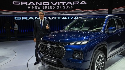 The managing director and chief executive officer of Maruti Suzuki India Limited (MSIL) Hisashi Takeuchi poses with the new SUV Grand Vitara during its global unveiling ceremony in Gurgaon on July 20, 2022. (Photo by Prakash SINGH / AFP) The managing director and chief executive officer of Maruti Suzuki India Limited (MSIL) Hisashi Takeuchi poses with the new SUV Grand Vitara during its global unveiling ceremony in Gurgaon on July 20, 2022. (Photo by Prakash SINGH / AFP)