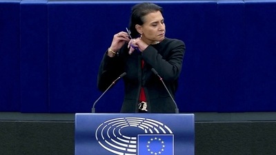 Iran Anti-Hijab Protests: Swedish lawmaker Abir Al-Sahlani cuts her hair at the European Parliament in Strasbourg, France. (Reuters)