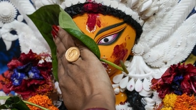 A woman performs rituals to an idol of Hindu goddess Durga before it is immersed in the Hooghly River in Kolkata. The immersion of idols marks the end of the festival that commemorates the slaying of a demon king by lion-riding, 10-armed goddess Durga, marking the triumph of good over evil. (AP) A woman performs rituals to an idol of Hindu goddess Durga before it is immersed in the Hooghly River in Kolkata. The immersion of idols marks the end of the festival that commemorates the slaying of a demon king by lion-riding, 10-armed goddess Durga, marking the triumph of good over evil. (AP)