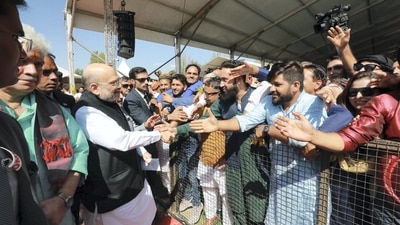 Amit Shah removed his bulletproof jacket as soon as he heard the Aazan in North Kashmir's Baramulla district. (PTI) Amit Shah removed his bulletproof jacket as soon as he heard the Aazan in North Kashmir's Baramulla district. (PTI)