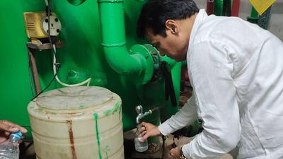 A member of the health department collects water samples from the society. (HT Photo) A member of the health department collects water samples from the society. (HT Photo)