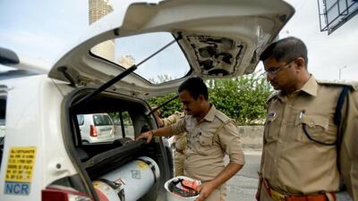 Cops inspect a car for smuggled liquor in Noida. (Sunil Ghosh/ HT) Cops inspect a car for smuggled liquor in Noida. (Sunil Ghosh/ HT)