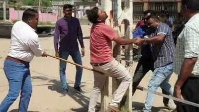 Policeman is seen hitting a suspect below the waist with a baton. (Twitter)
