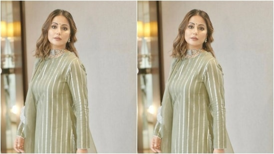 Hina further teamed her salwar with a pair of moss green sharara with silver zari work at the ankles and wide legs. In a moss green dupatta with silver frill details at the borders, she completed her look for the day.(Instagram/@realhinakhan)