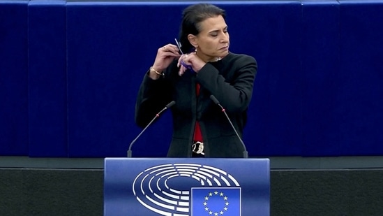 Iran Anti-Hijab Protests: Swedish lawmaker Abir Al-Sahlani cuts her hair at the European Parliament in Strasbourg, France.(Reuters)