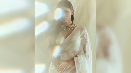 Mouni Roy wore a white sheer saree featuring light embroidery work and teamed it with a sleeveless blouse.(Instagram/@imouniroy)