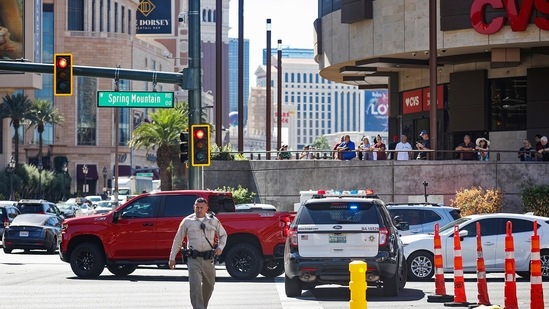 Police work at the scene where multiple people were stabbed in front of a Strip casino in Las Vegas, Thursday, October 6, 2022. (Rachel Aston/Las Vegas Review-Journal via AP)