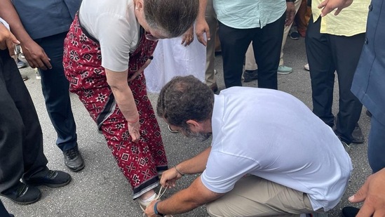 Congress leader Rahul Gandhi ties the shoelaces of his mother and party interim President Sonia Gandhi during the party's 'Bharat Jodo Yatra'.(PTI) Congress leader Rahul Gandhi ties the shoelaces of his mother and party interim President Sonia Gandhi during the party's 'Bharat Jodo Yatra'.(PTI)