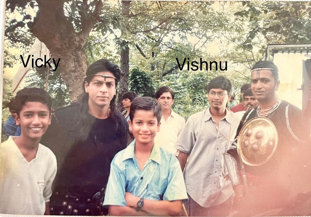 Vicky Kaushal with Shah Rukh Khan, brother Sunny Kaushal and filmmaker Vishnuvardhan on the set of Asoka. Vicky Kaushal with Shah Rukh Khan, brother Sunny Kaushal and filmmaker Vishnuvardhan on the set of Asoka. 
