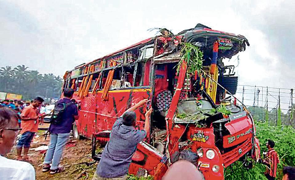 Locals at the site of the accident after a collision between a private tourist bus and a Kerala State Road Transport Corporation (KSRTC) bus on Wednesday night, at Vadakkenchery in Palakkad district, Thursday, October 6, 2022. (PTI Photo)