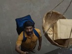 Kapil Sharma as a delivery boy in a still from Zwigato trailer. Kapil Sharma as a delivery boy in a still from Zwigato trailer.