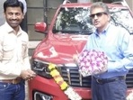 Anand Mahindra (right) receives his Scorpio-N.&nbsp;