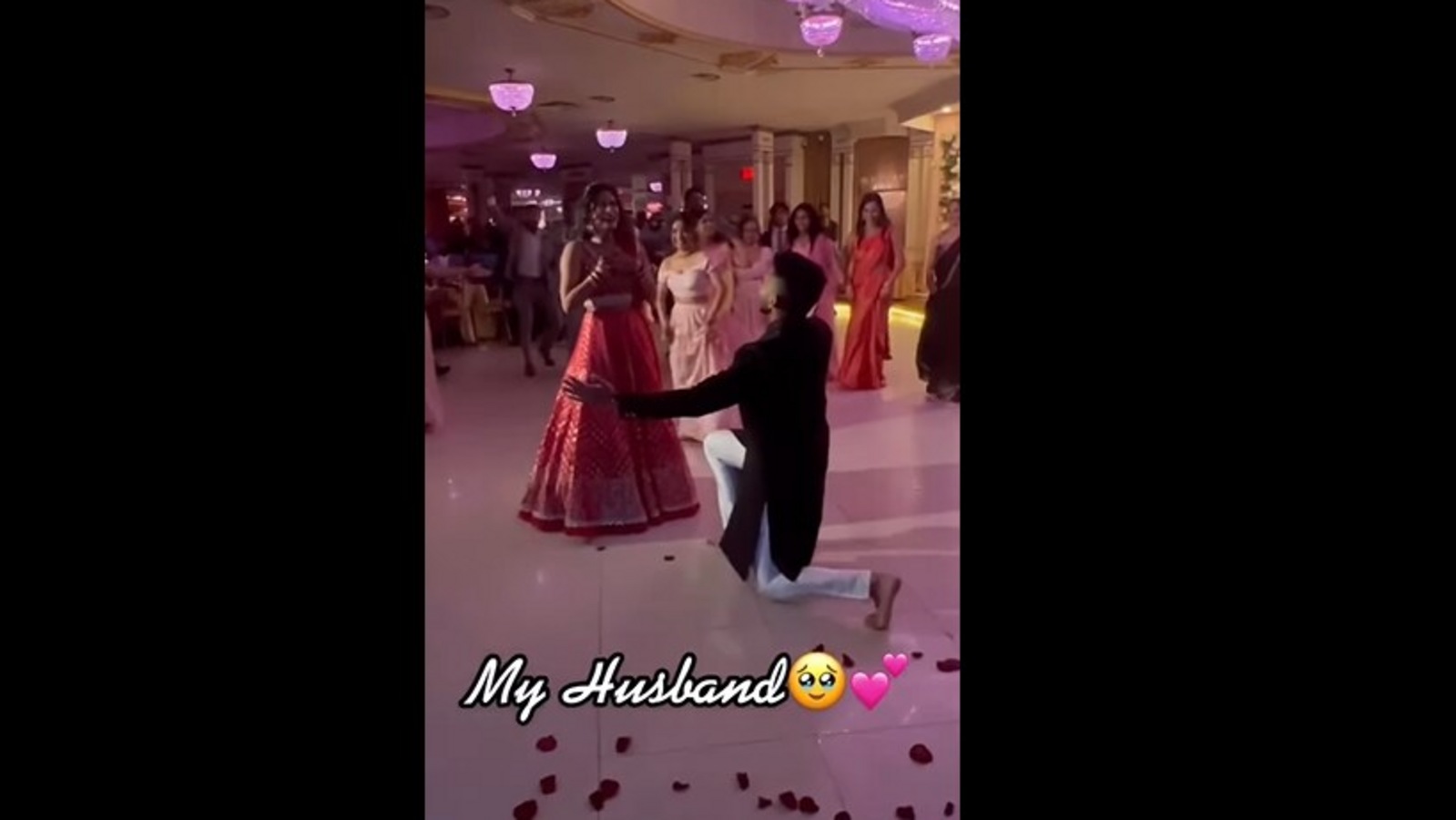 The family surprises the bride with a Bollywood-style dance performance.  Watch |  Tendency