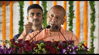 UP CM Yogi Adityanath speaking at the valedictory function of the golden jubilee celebrations of Amitabh Bachchan Sports Complex in Prayagraj on Friday. (HT)