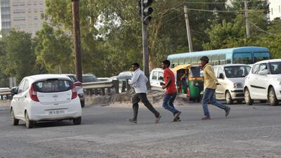 Pedestrians cross the road at Vatika Chowk. The underpass is part of a larger project to upgrade the Southern Peripheral Road (SPR) from Ghata village to Kherki Daula on the national highway. (HT Archive)