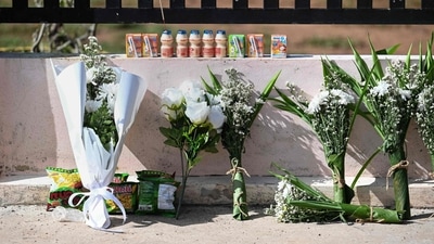 Traumatised parents and relatives of the victims created a makeshift altar of flowers, juice boxes and a stuffed animal at the day care center. (AFP) Traumatised parents and relatives of the victims created a makeshift altar of flowers, juice boxes and a stuffed animal at the day care center. (AFP)