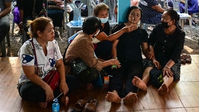 Grieving relatives of the Thailand massacre victims gathered at the child day care centre in Thailand on Friday where a day earlier a former policeman had slain 34 people in a knife and gun rampage that horrified the nation. At least 24 of the 36 people killed in the shooting were children, aged between two and five years. (AFP) Grieving relatives of the Thailand massacre victims gathered at the child day care centre in Thailand on Friday where a day earlier a former policeman had slain 34 people in a knife and gun rampage that horrified the nation. At least 24 of the 36 people killed in the shooting were children, aged between two and five years. (AFP)