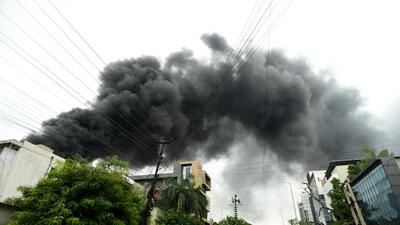 Noida, India- October 07, 2022: A fire broke out in Sector 3on Friday afternoon at a thermocol and plastic factory. Fifteen fire tenders were at the spot to douse the fire. The factory workers had escaped the building as soon as smoke started from the back of the factory. Officials said no one was trapped inside and everyone got out safely, in Noida, India, on Friday, October 07, 2022. (Photo by Sunil Ghosh / Hindustan Times) (Hindustan Times)