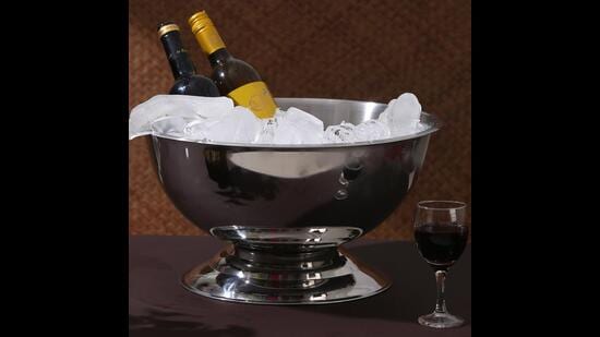 After serving, place the bottle gently into your Champagne bucket. This will keep it nice and cool until you are ready for some more. (The large, multi-bottle, stainless steel champagne bucket by Amoliconcepts)