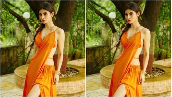 Mouni played muse to fashion designer house Deme and picked a bright orange attire from the shelves of the designer house.(Instagram/@imouniroy)