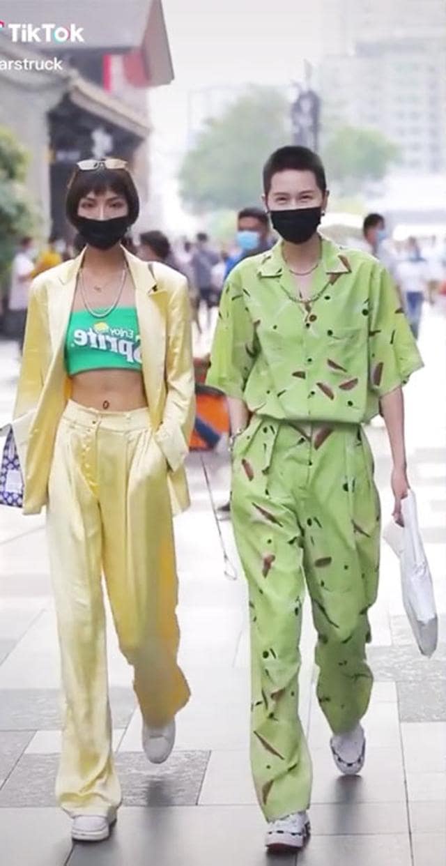Chinese people walking on the streets of China in street style ensembles (Photo: Twitter)