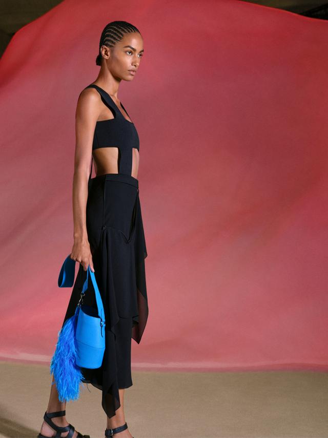 A dress in silk georgette was embroidered with black graduated sequins in black lambskin with straps in black cord A dress in silk georgette was embroidered with black graduated sequins in black lambskin with straps in black cord