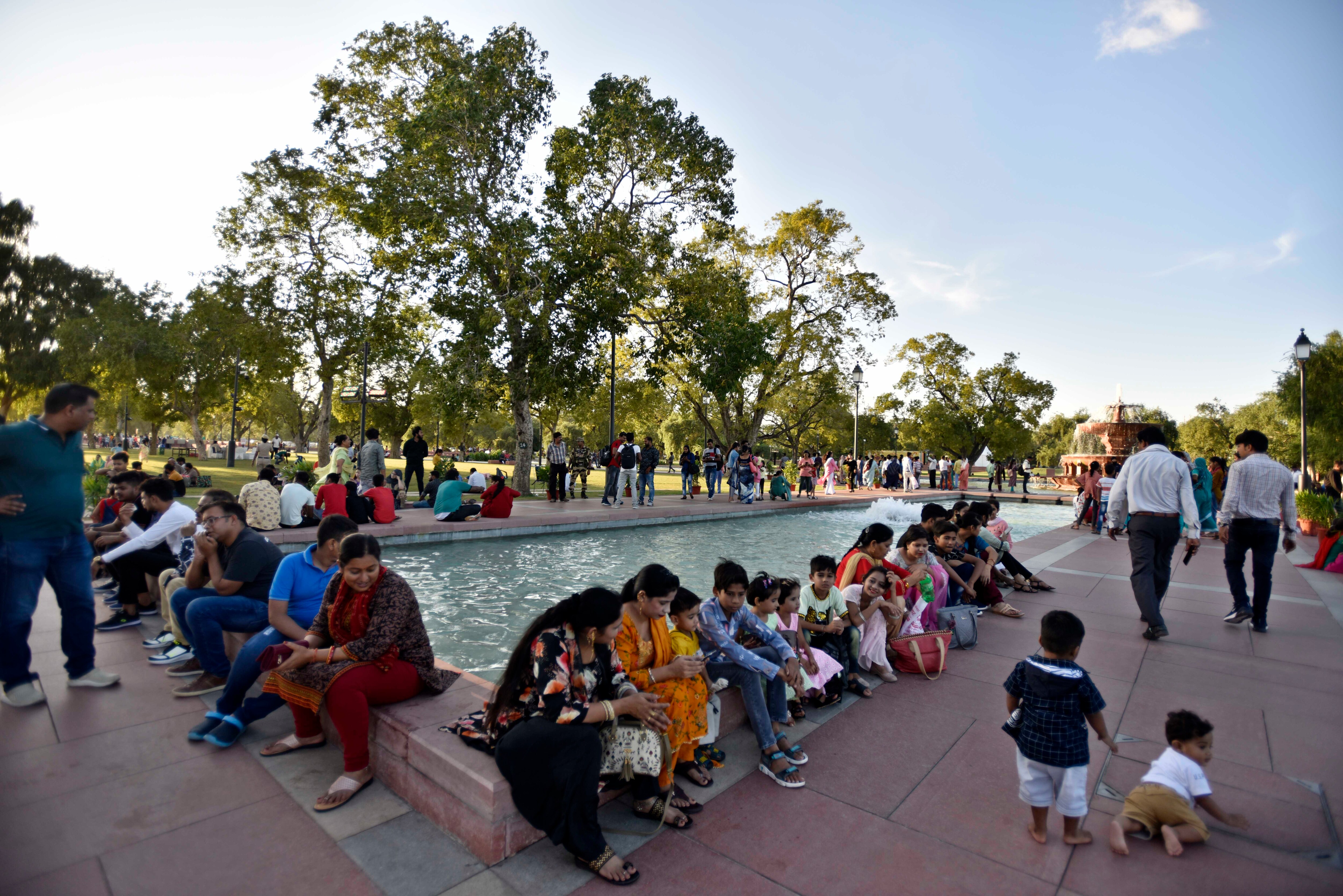 Visitors seen at India Gate (part of the revamped Central Vista Avenue) in New Delhi, India, (Photo by Sanjeev Verma/Hindustan Times)