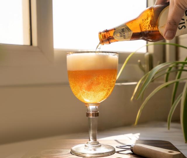 Good beers should be served in the bottle with an empty glass, which lets the drinker control how much he pours and the head on the beer. (Six Fields Blanche by DeVANS) Good beers should be served in the bottle with an empty glass, which lets the drinker control how much he pours and the head on the beer. (Six Fields Blanche by DeVANS)