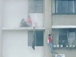 Residents trying to escape as the fire broke out on the 12th floor of a residential building in Mumbai's Chembur area. Residents trying to escape as the fire broke out on the 12th floor of a residential building in Mumbai's Chembur area.