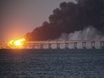 Flame and smoke rise from Crimean Bridge connecting Russian mainland and Crimean Peninsula over the Kerch Strait, in Kerch, Crimea, Saturday, October 8, 2022. (AP Photo) Flame and smoke rise from Crimean Bridge connecting Russian mainland and Crimean Peninsula over the Kerch Strait, in Kerch, Crimea, Saturday, October 8, 2022. (AP Photo)