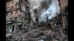 A Ukrainian firefighter pushes out a fire after a strike in Zaporizhzhia on October 6, 2022 (AFP) A Ukrainian firefighter pushes out a fire after a strike in Zaporizhzhia on October 6, 2022 (AFP)