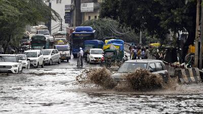 New Delhi, Oct 08 (ANI): Vehicles wade through a waterlogged road following heavy rainfall, in New Delhi on Saturday. (ANI Photo) (Ishant)
