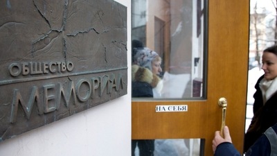 Nobel Peace Prize 2022: People talk near the entrance to human rights group Memorial's office, in Moscow, Russia. (AP File) Nobel Peace Prize 2022: People talk near the entrance to human rights group Memorial's office, in Moscow, Russia. (AP File)