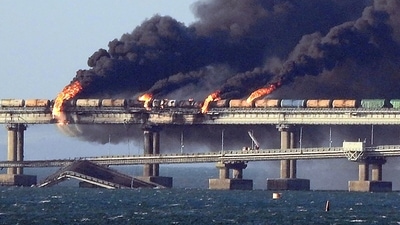 Black smoke billows from a fire on the Kerch bridge that links Crimea to Russia, after a truck exploded, near Kerch, on October 8, 2022.&nbsp; (AFP)