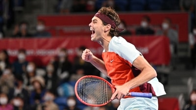 Taylor Fritz of the US celebrates his win over Denis Shapovalov of Canada after their men's singles semi final match at the Japan Open