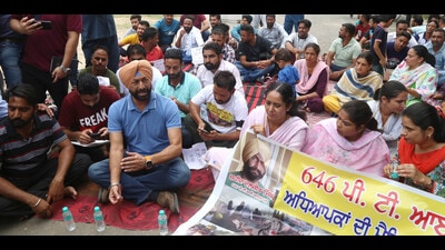 Physical training instructors protesting in Mohali on Saturday over their demand for government jobs. (HT Photo)