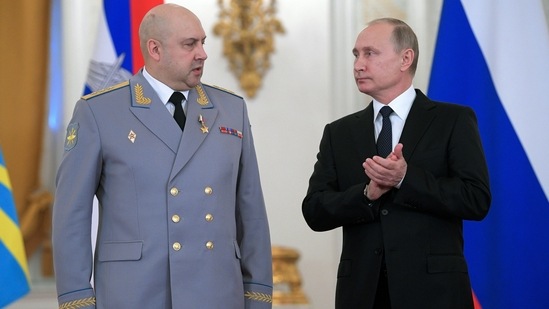 Russian President Vladimir Putin (right) applauds Col. Gen. Sergei Surovikin during an awards ceremony for troops who fought in Syria, in Moscow.&nbsp;(AP file)