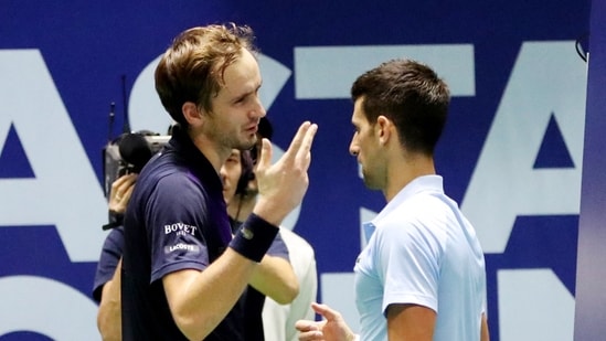 Serbia's Novak Djokovic and Russia's Daniil Medvedev after their semi final match(REUTERS)