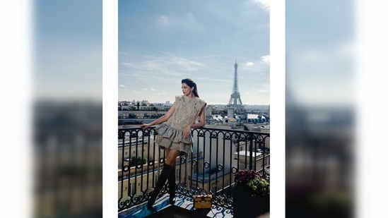 Deepika Padukone posed elegantly in her hotel balcony with the iconic Eiffel Tower featuring in the backdrop.(Instagram/@deepikapdukone)