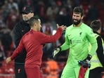Liverpool's manager Jurgen Klopp, left, Thiago, centre, and goalkeeper Alisson celebrate after the Champions League Group A match (AP) Liverpool's manager Jurgen Klopp, left, Thiago, centre, and goalkeeper Alisson celebrate after the Champions League Group A match (AP)