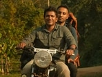 Puneeth Rajkumar with Narendra Modi (left) and in a still from GG trailer.&nbsp;