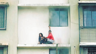 Mumbai, India - October 08, 2022: Residents trying to escape after a Level-2 fire broke out on the 12th floor of a residential building Rail View Housing Society around 2:45 pm in the afternoon. Around 33 people were safely rescued by firefighters from the building in the New Tilak Nagar area, near Lokmanya Tilak Terminus station, Chembur, in Mumbai, India, on Saturday, October 08, 2022. (Photo by Satish Bate/Hindustan Times) (Satish Bate/HT PHOTO) Mumbai, India - October 08, 2022: Residents trying to escape after a Level-2 fire broke out on the 12th floor of a residential building Rail View Housing Society around 2:45 pm in the afternoon. Around 33 people were safely rescued by firefighters from the building in the New Tilak Nagar area, near Lokmanya Tilak Terminus station, Chembur, in Mumbai, India, on Saturday, October 08, 2022. (Photo by Satish Bate/Hindustan Times) (Satish Bate/HT PHOTO)