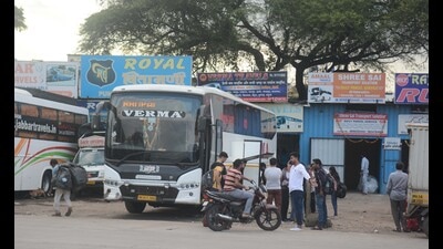 Passengers wait to board a sleeper bus at Sangamwadi on Sunday. (Shankar Narayan/HT PHOTO) Passengers wait to board a sleeper bus at Sangamwadi on Sunday. (Shankar Narayan/HT PHOTO)