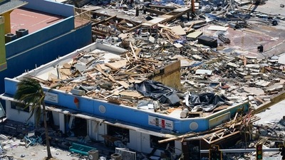 Commercial business are seen in the wake of Hurricane Ian, September 29 in Fort Myers Beach, Fla. (AP) Commercial business are seen in the wake of Hurricane Ian, September 29 in Fort Myers Beach, Fla. (AP)