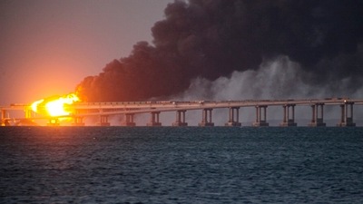 Flame and smoke rise from Crimean Bridge connecting Russian mainland and Crimean peninsula over the Kerch Strait, in Kerch, Crimea, Saturday, Oct. 8, 2022. (AP) Flame and smoke rise from Crimean Bridge connecting Russian mainland and Crimean peninsula over the Kerch Strait, in Kerch, Crimea, Saturday, Oct. 8, 2022. (AP)