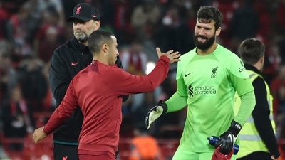 Liverpool's manager Jurgen Klopp, left, Thiago, centre, and goalkeeper Alisson celebrate after the Champions League Group A match (AP) Liverpool's manager Jurgen Klopp, left, Thiago, centre, and goalkeeper Alisson celebrate after the Champions League Group A match (AP)