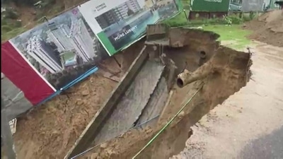 Large portion of road caves in under Bisrakh police station limits in Greater Noida West. (ANI) Large portion of road caves in under Bisrakh police station limits in Greater Noida West. (ANI)