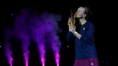 Czech Republic's Barbora Krejcikova celebrates with a trophy after winning the singles final against Poland's Iga Swiatek (REUTERS)