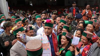 Himachal Pradesh CM Jai Ram Thakur takes a selfie with locals at Kinnaur on Sunday. (HT Photo)
